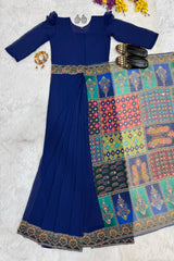 Blue saree with a colorful patterned border on a white background