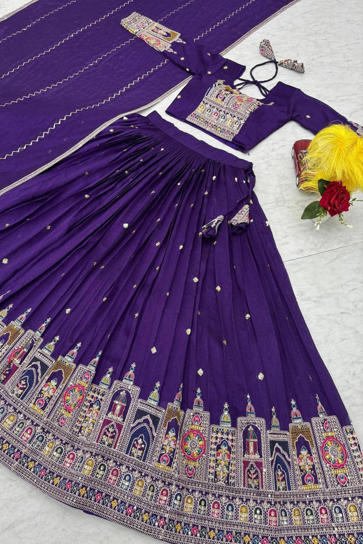 Purple traditional outfit with intricate designs on a white background
