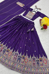 Purple traditional outfit with intricate designs on a white background
