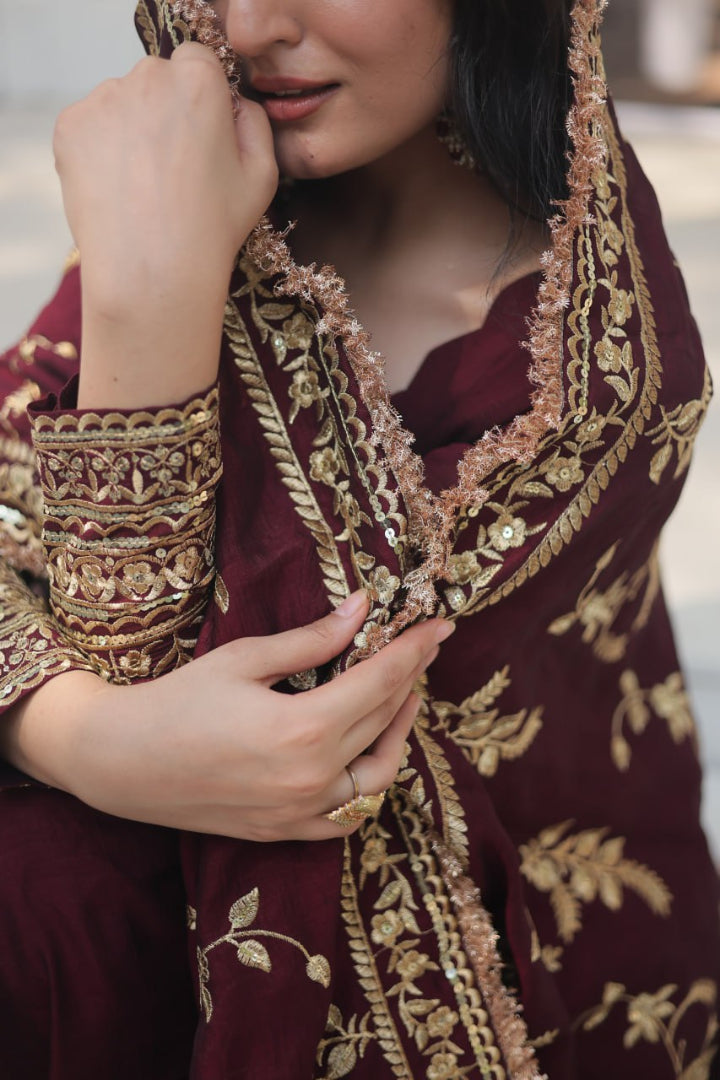 Maroon traditional outfit with gold embroidery
