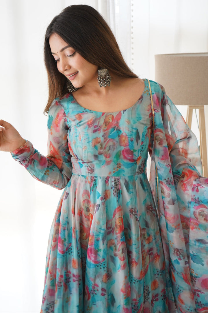 Woman wearing a floral dress in a bright room