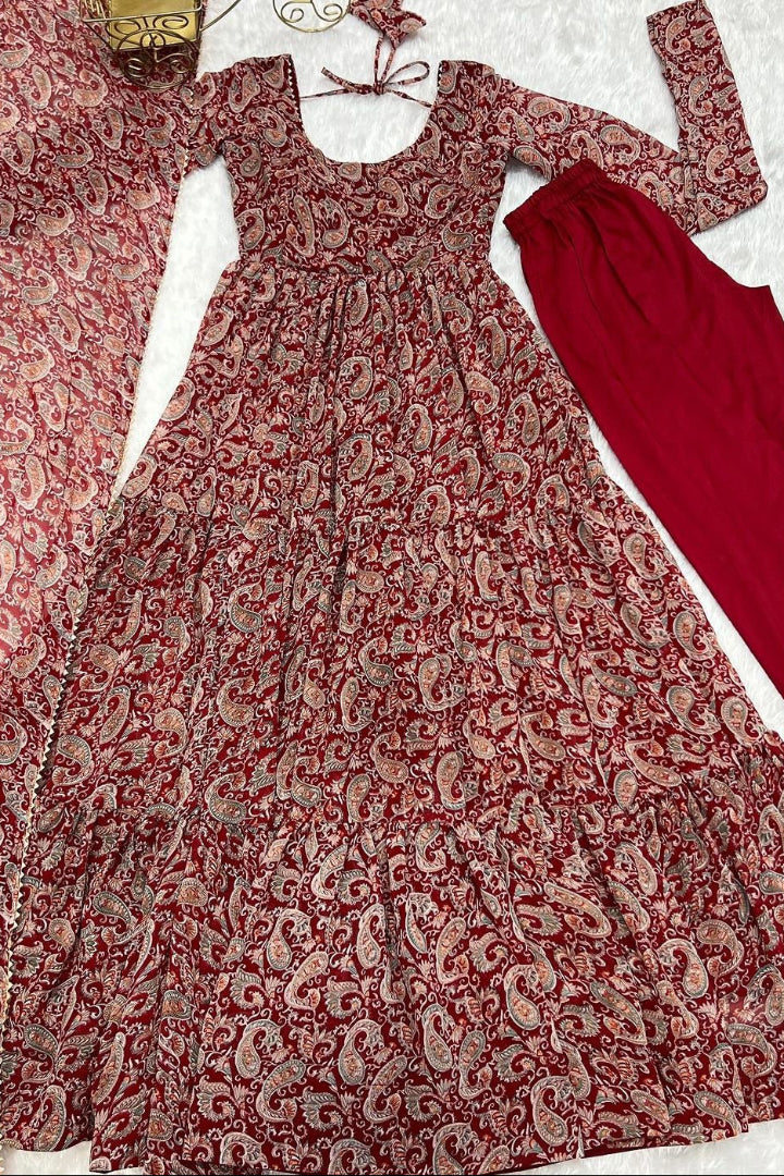 Red and white patterned dress with red pants on a light background