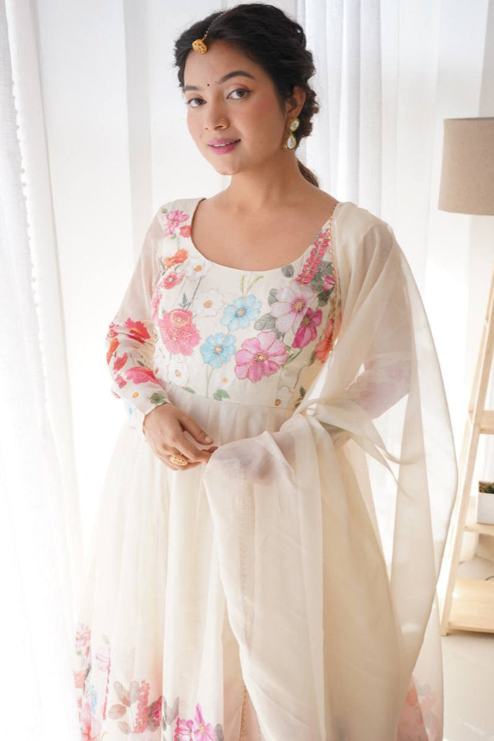 Woman wearing a floral dress with a light background