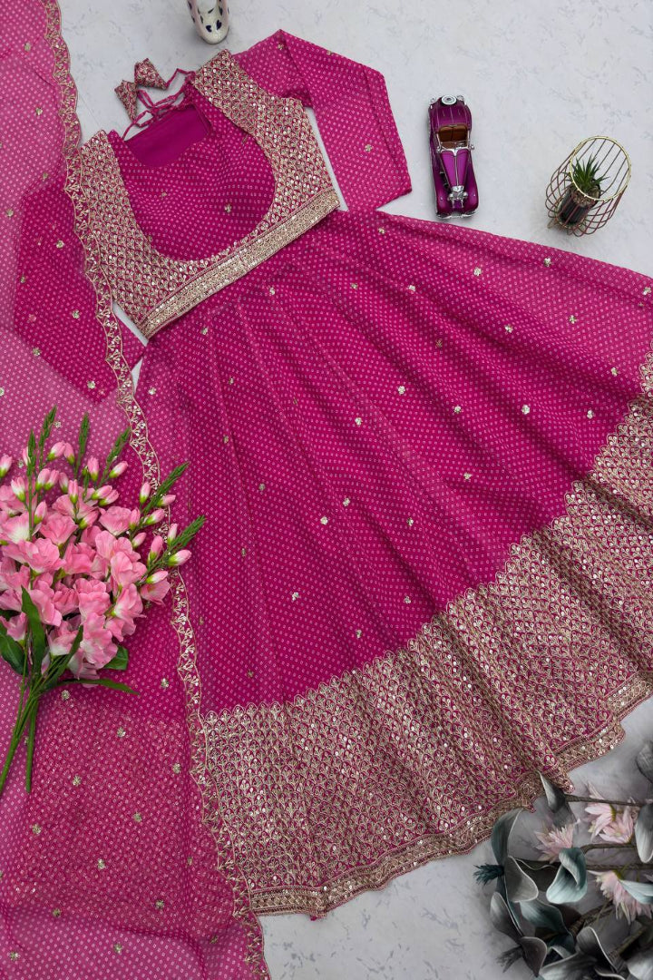 Pink traditional outfit with floral decorations on a light gray background