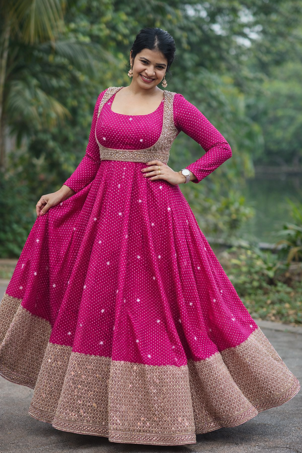 Woman wearing a pink and brown traditional outfit with a blurred green background