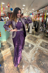 Woman in a purple saree with a matching blouse in a store setting