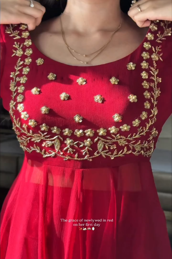Red dress with gold embroidery on a blurred background