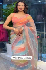 Woman wearing a colorful saree with text 'Trending Saree' in an indoor setting.