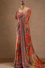 Colorful saree with intricate patterns on a mannequin against a plain background