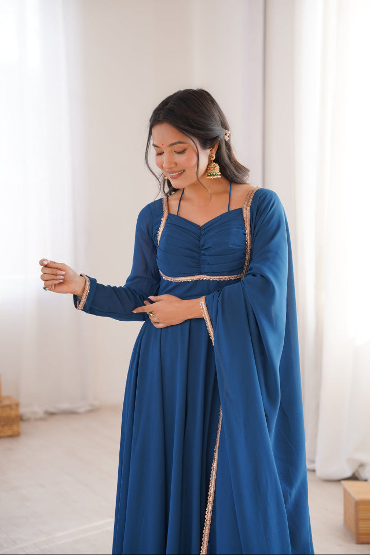 Woman wearing a blue dress with a white background