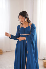 Woman wearing a blue dress with a white background