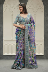 Woman wearing a colorful saree with a patterned background