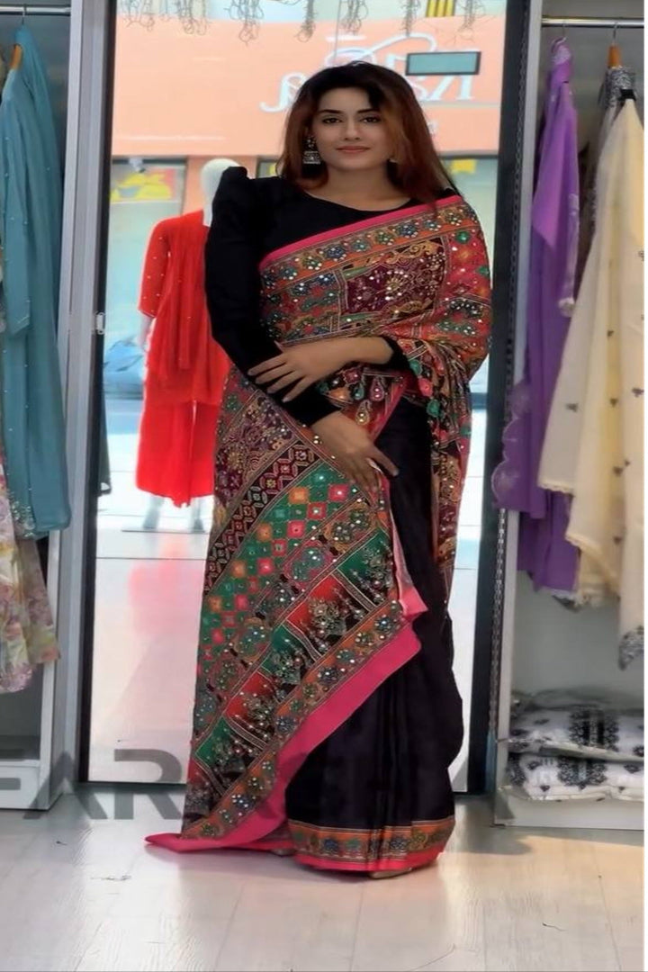 Woman wearing a traditional saree in a clothing store