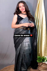 Woman wearing a black and silver saree with text 'Love to wear' and a heart emoji.