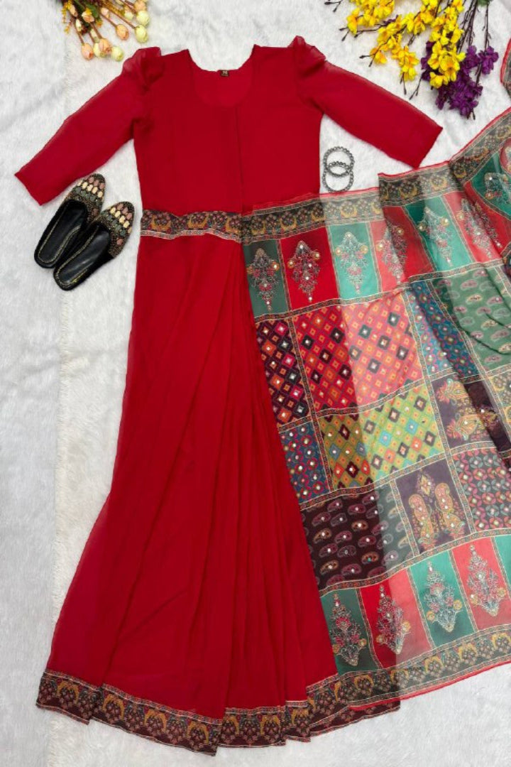 Red dress with a colorful patchwork sari on a light background