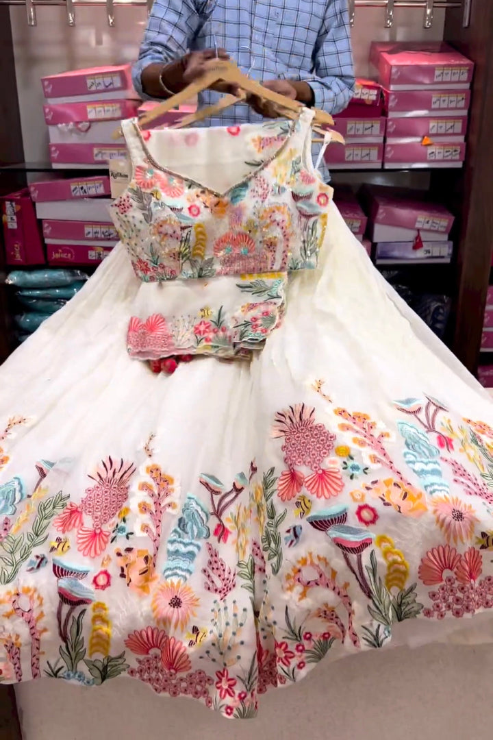 Floral dress on a hanger with a blurred background of boxes.