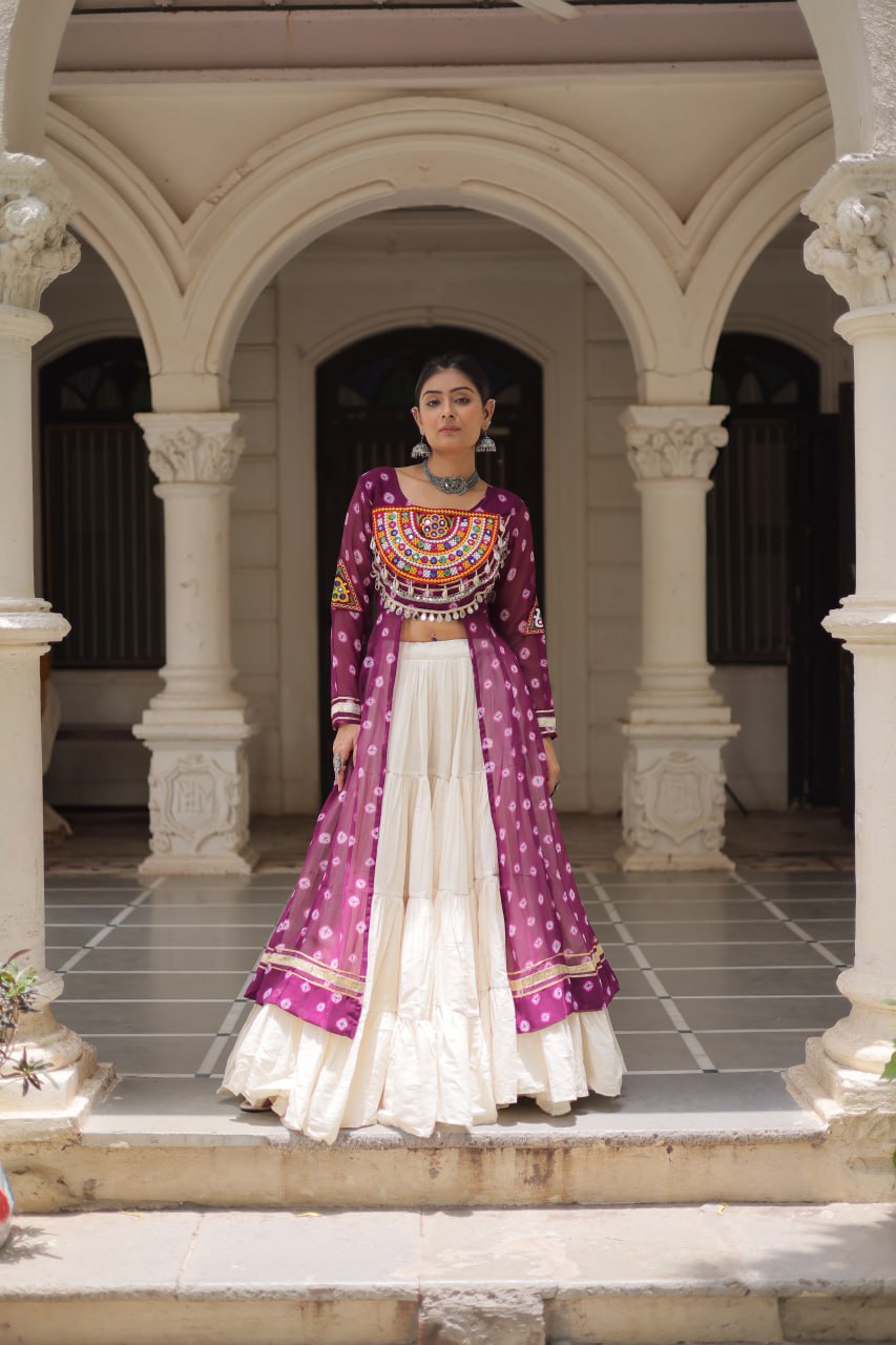 Woman in a traditional outfit standing in an architectural setting