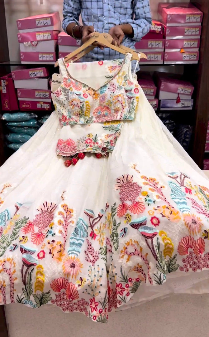 Floral blouse and skirt set on a hanger with boxes in the background